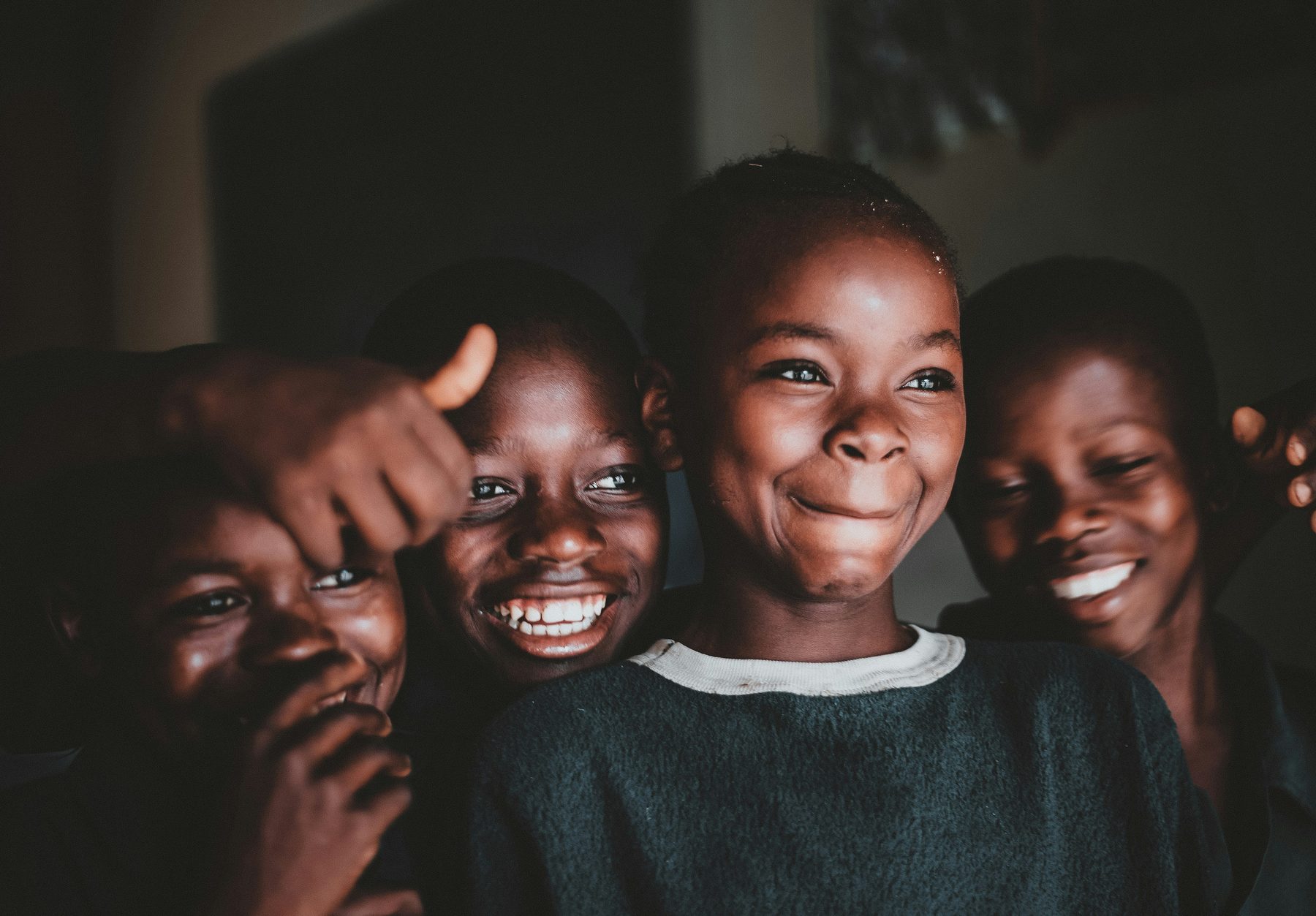 Students smiling together at school in Ghana